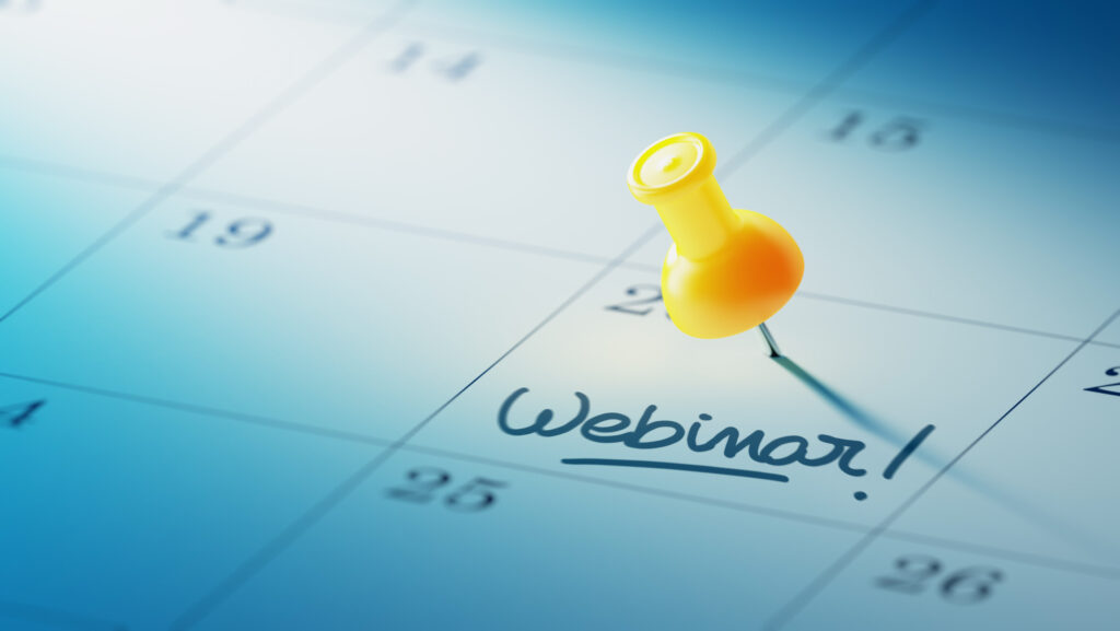Concept image of a Calendar with a yellow push pin. Closeup shot of a thumbtack attached. The words Webinar written on a white notebook to remind you an important appointment.